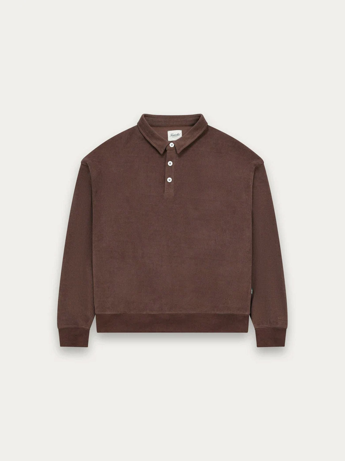 The Kuwalla Chenille Polo, in brown, features long sleeves, a collar, and a three-button placket. Crafted from soft velvety fabric for a relaxed feel, it is shown against a plain white background.