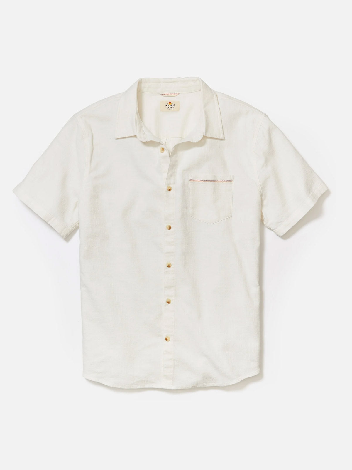 The Marine Layer Classic Stretch Selvage Shirt by Marine Layer features short sleeves, an off-white hue, a single chest pocket, and a subtle collar. Crafted from comfortable stretch fabric and shown against a plain white background.