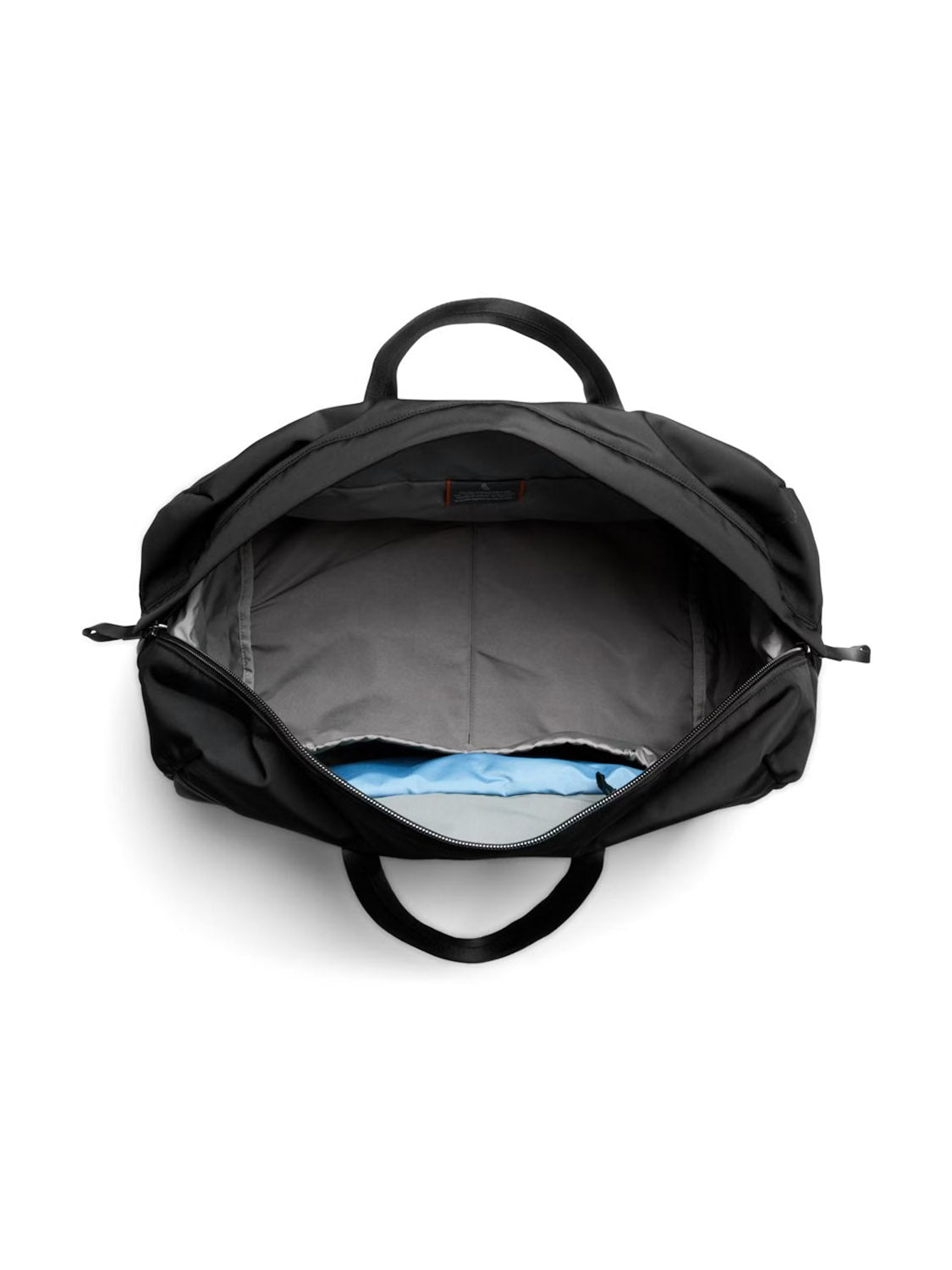 A top-down view of the Bellroy Classic Weekender Duffle Bag - 45L, showing its spacious interior, gray and light blue lining, black side handles, and a handy luggage pass-through for effortless travel.