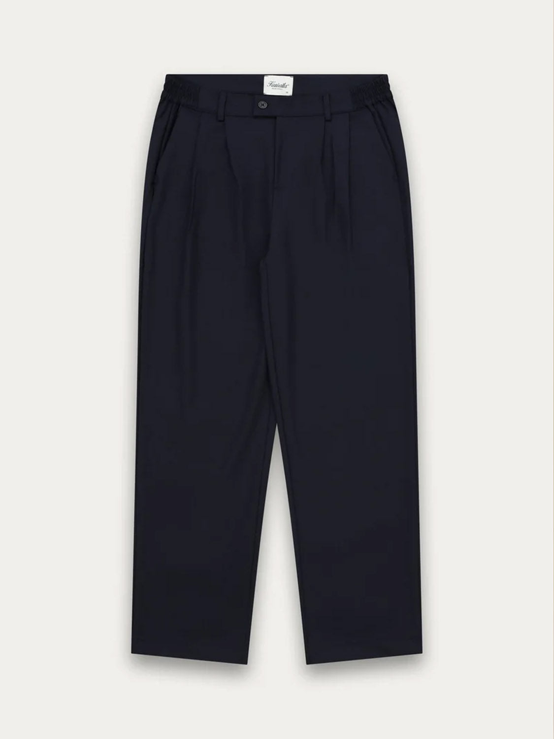 The Kuwalla Double Pleated Pants are black, high-waisted, and tailored with double pleats, belt loops, side pockets, and a button closure, shown laid flat on a plain light background.
