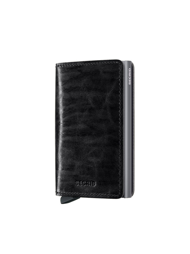 The Secrid Slimwallet Dutch Martin, a black leather wallet with a textured finish and embossed branding, features RFID protection and stands upright against a plain white background.