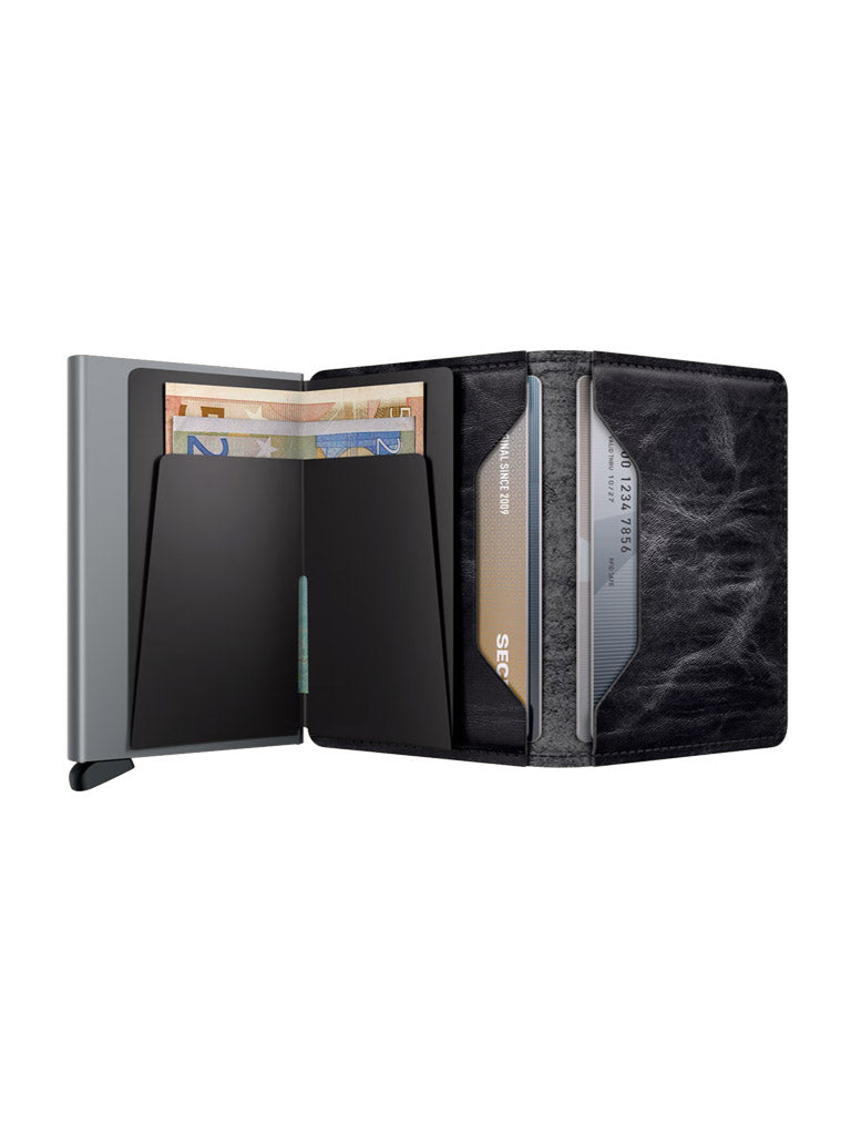 The Secrid Slimwallet Dutch Martin, a black leather wallet with a modern, minimalist design, features a metallic RFID-protected section and neatly organized compartments for banknotes and credit cards.