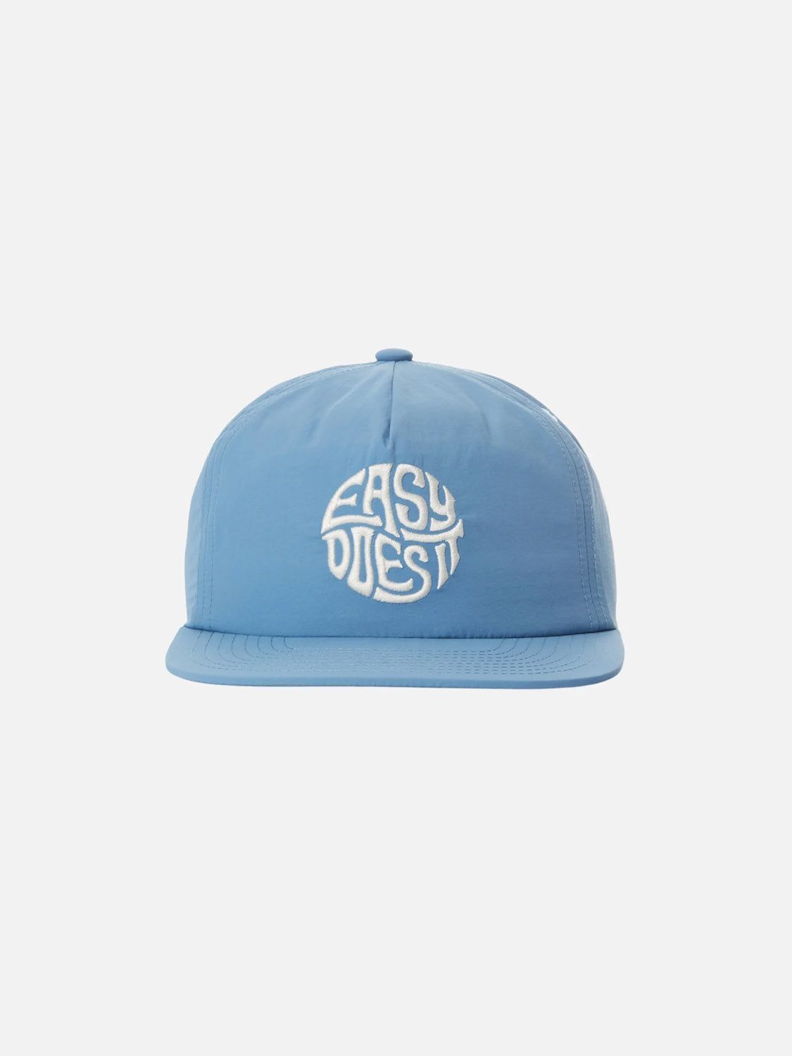 The Katin Easy Emblem Hat, part of the Katin headwear collection, is a light blue flat-brim baseball cap with custom front embroidery displaying EASY DOES IT in a circular design against a plain white background.