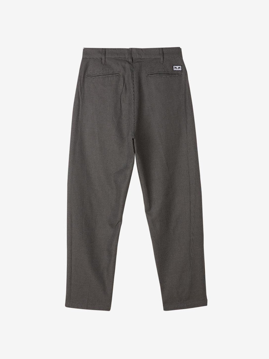 Back view of Obey Fubar Houndstooth Pleated Pant in gray and black, featuring belt loops, two back pockets, a small white label above the right pocket, and a relaxed fit for comfort. Laid flat on a white background.