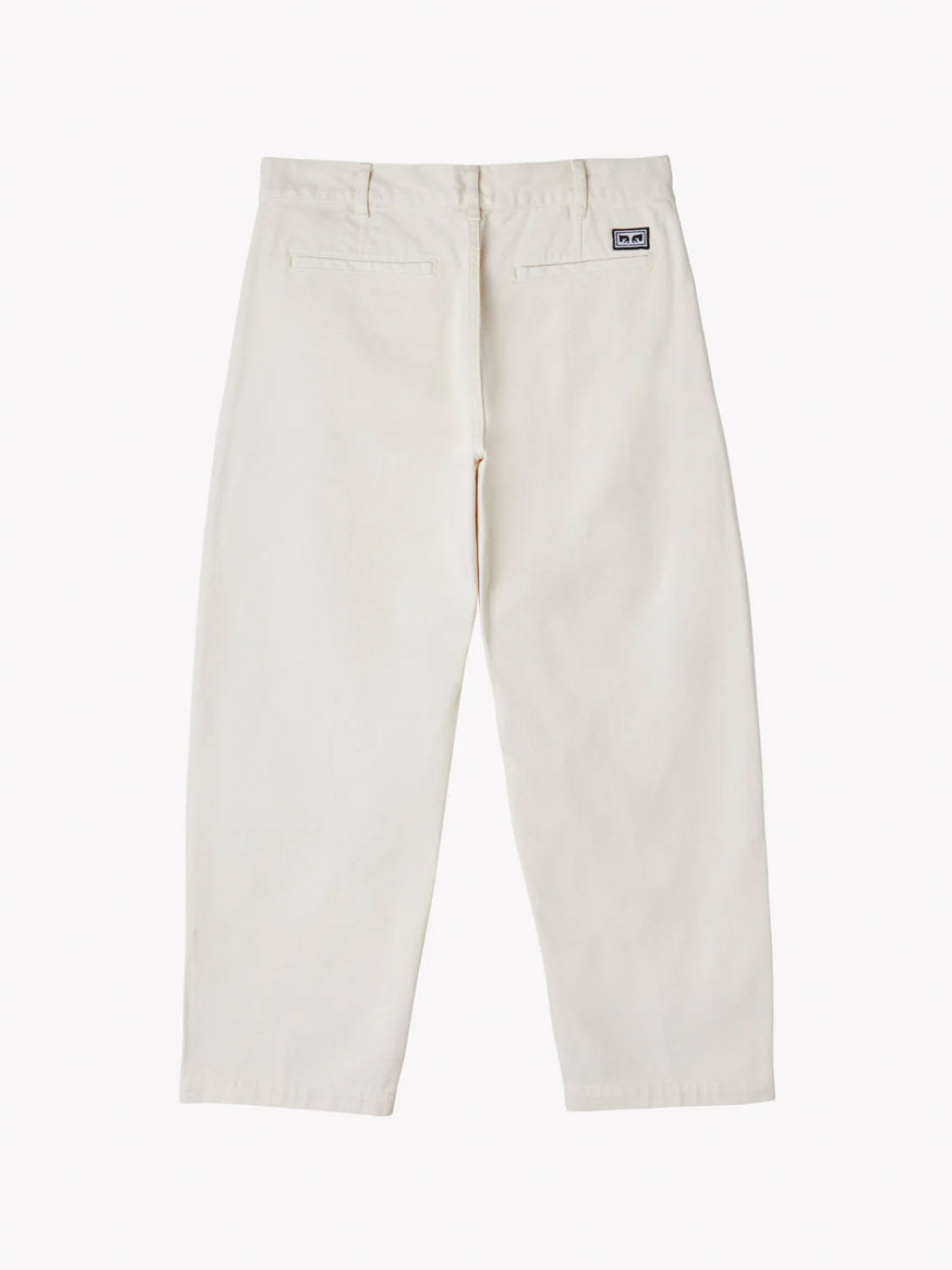 The image shows the Obey Fubar Pleated Denim trousers in off-white from the back. These trousers have a straight-leg design, premium denim fabrication, two subtly stitched back pockets, and a small rectangular patch near the waistband against a plain white background.