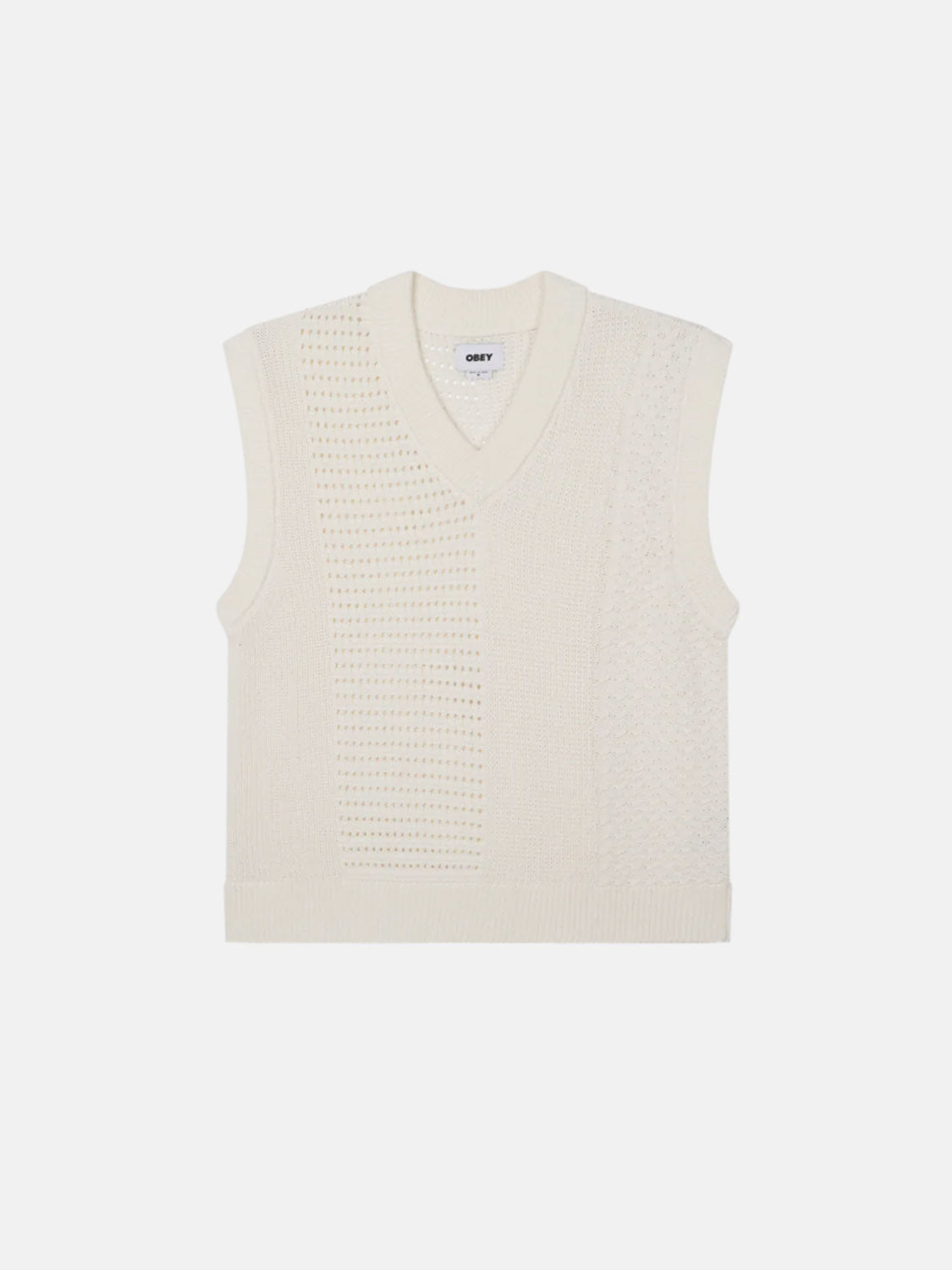 Introducing the Obey Garret Sweater Vest in a cream-colored knit, featuring a regular fit and mixed textures. Made from 100% cotton, this stylish sleeveless piece from Obey combines comfort with elegance against a plain white background.