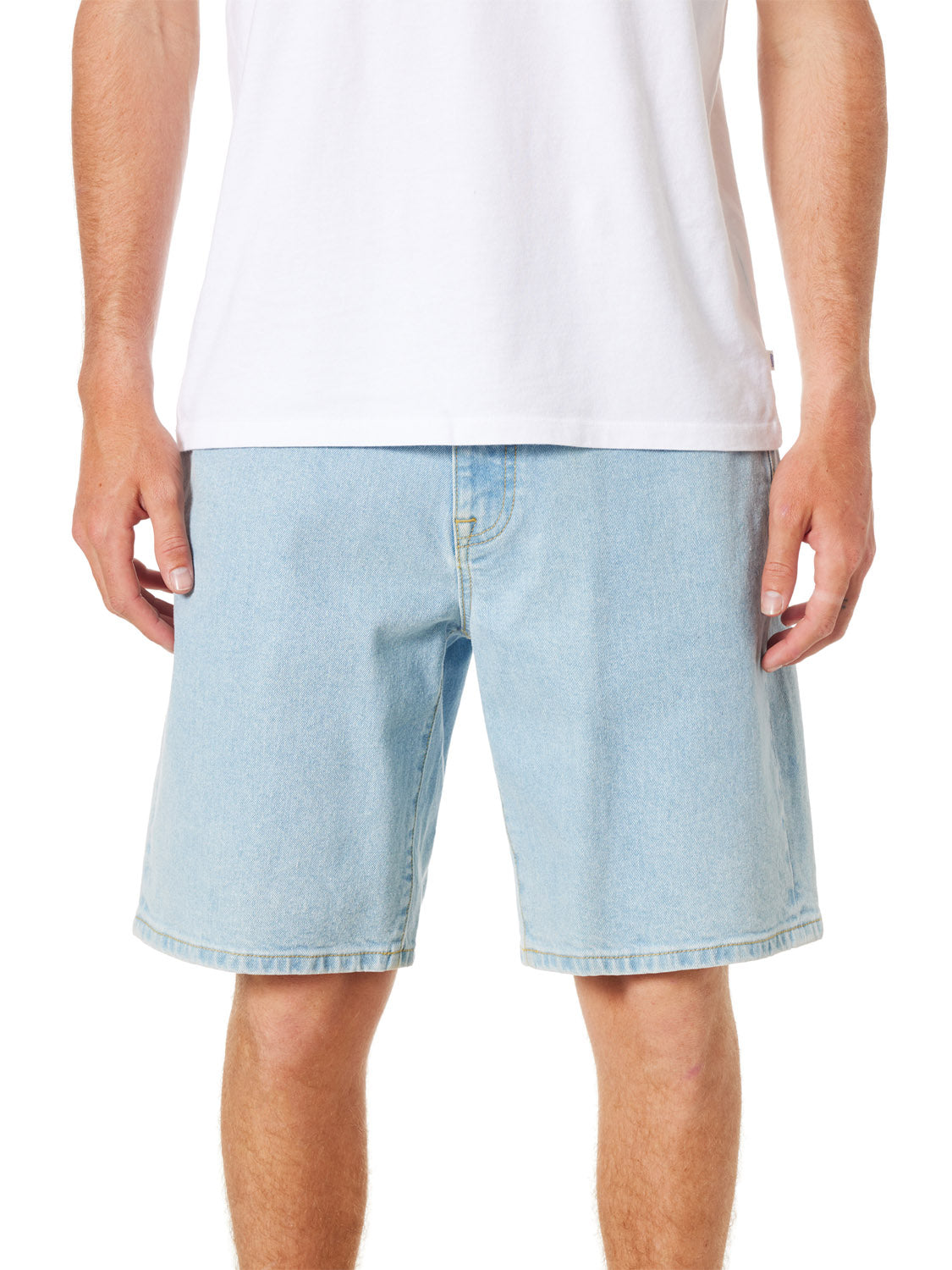 A person in a relaxed fit white t-shirt and light blue Katin George 64 Short - 20 stands with arms at their sides. The image, cropped from shoulders to knees, highlights the casual appeal of this ensemble.