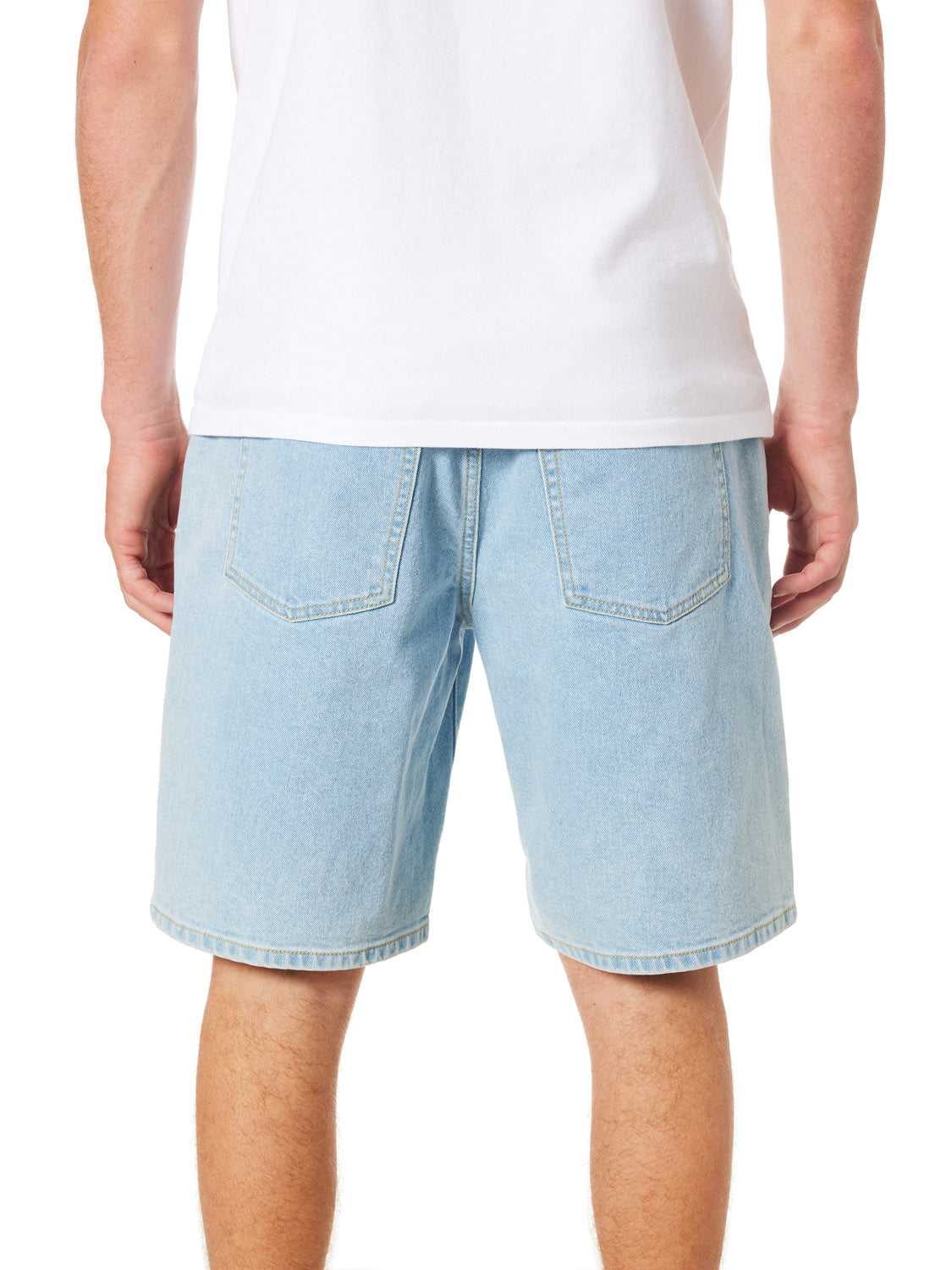 A person is seen from the back wearing a plain white T-shirt and Katin George 64 Short - 20 in relaxed fit denim. These classic wash shorts, featuring two visible back pockets, finish just above the knees against a plain white background.
