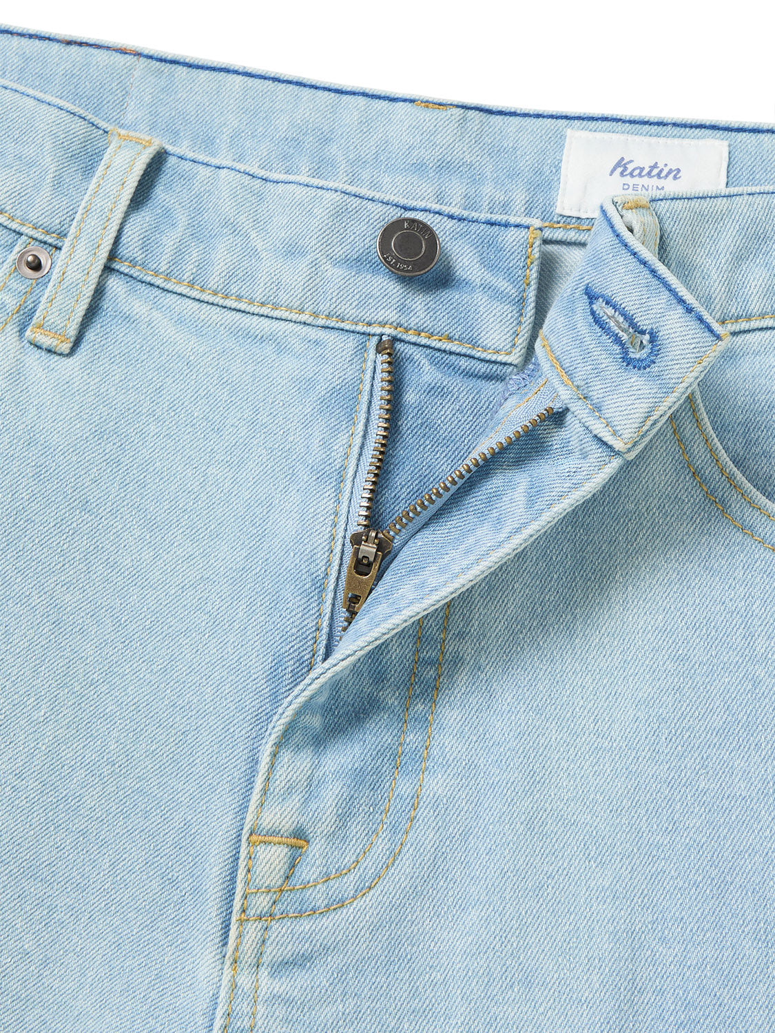 Close-up of Katin George 64 Short - 20 in light blue denim with classic wash, partially open zipper, fastened top button, and visible stitching around pockets and waistband.