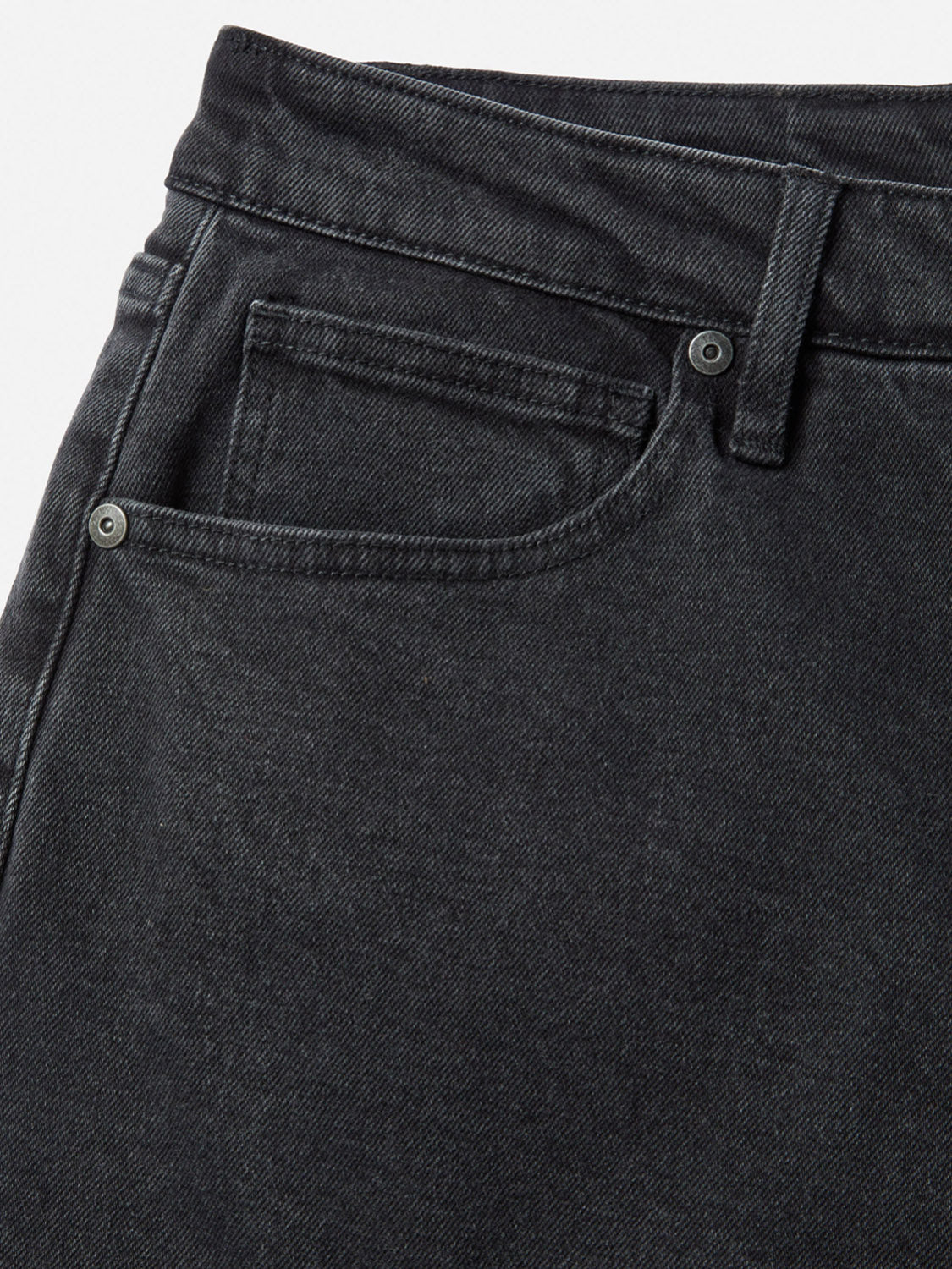 Close-up of the front pocket area of Katin's George 64 Relaxed Pants, featuring classic 5-pocket styling, detailed stitching, a coin pocket, belt loop, and metal rivets. Ideal for fans of a relaxed fit. Displayed on a white background.