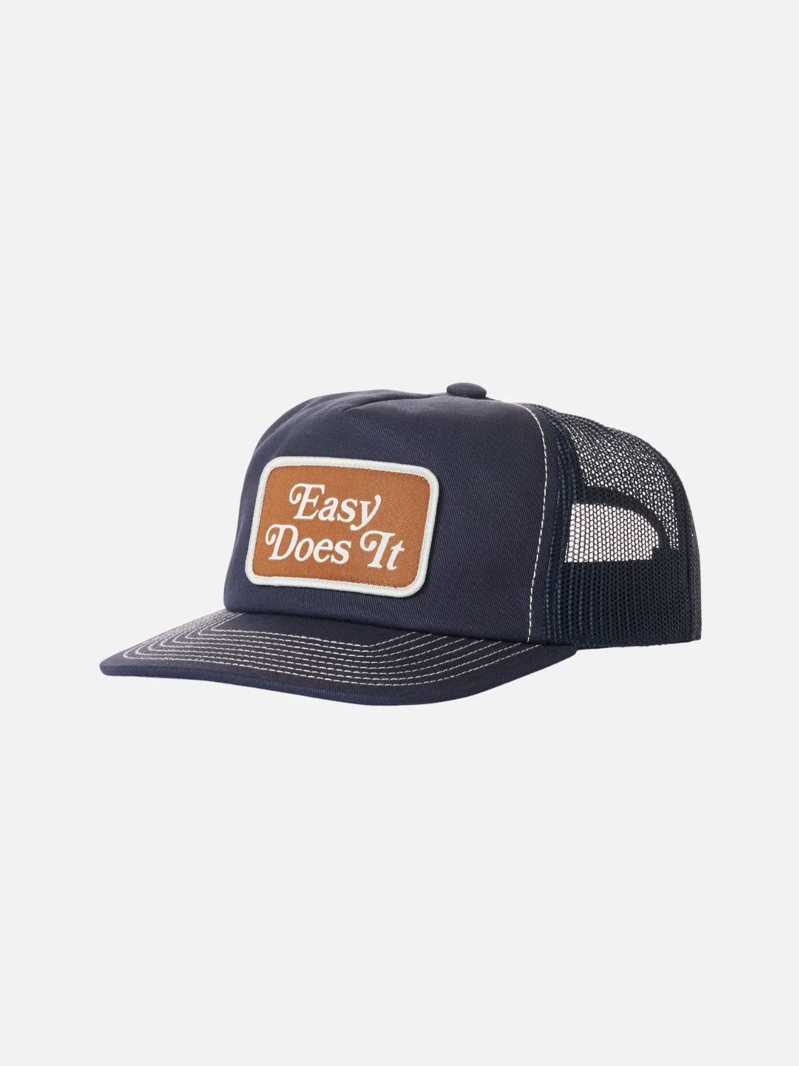 The Katin Good Times Trucker Hat features a navy blue mesh design with a flat brim, cotton twill build, a brown patch reading "Easy Does It" in white, and an adjustable snapback closure for a perfect fit.