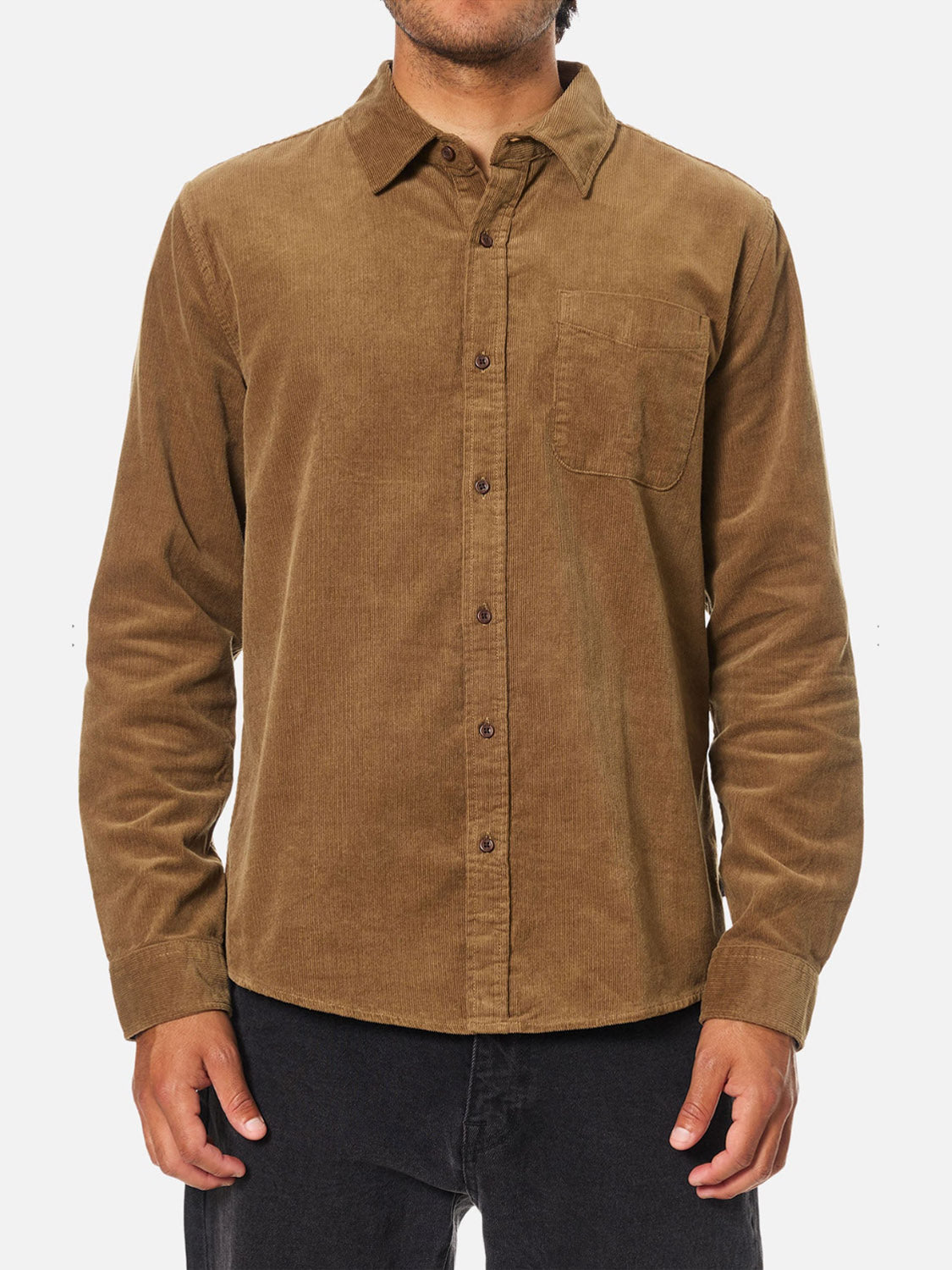 A man wears the Katin Granada Shirt—a soft cotton corduroy, long-sleeve, button-down shirt with a chest pocket—standing against a plain white background.
