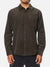 A person wears the Katin Granada Shirt, a dark brown cotton corduroy button-down with a chest pocket, standing against a plain white background.