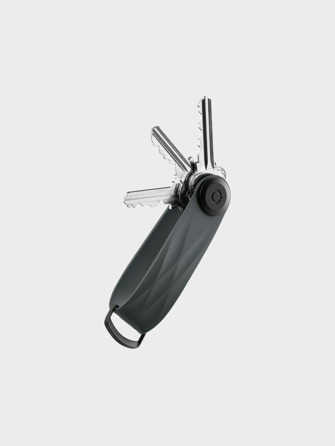 The Orbitkeys Key Organizer Rubber Active features a textured black handle, securely holding several silver keys fanned out against a plain light gray background.