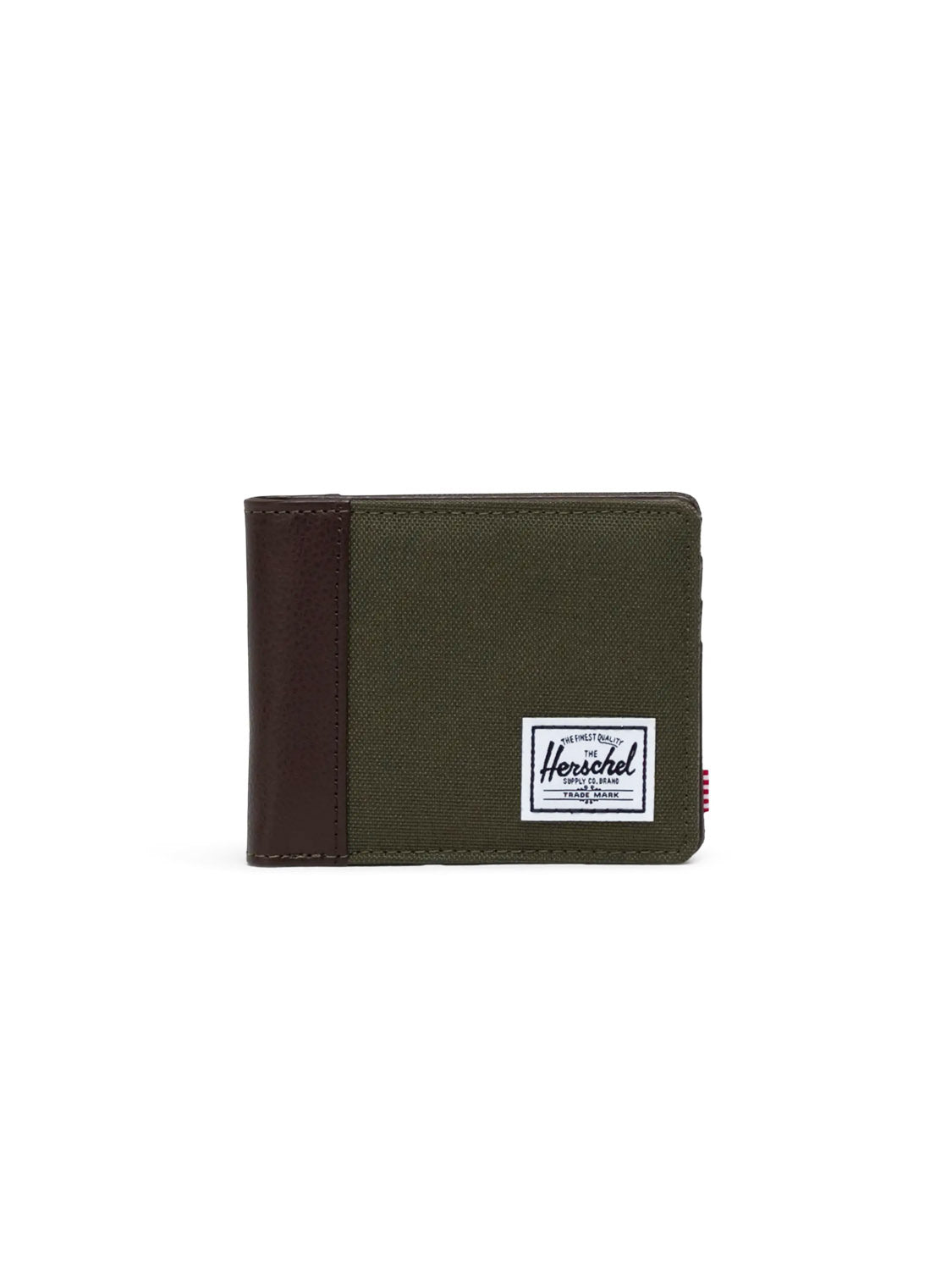 The Herschel Hank Wallet is a green and brown synthetic leather bi-fold with a white rectangular Herschel label on the front, shown against a plain white background.