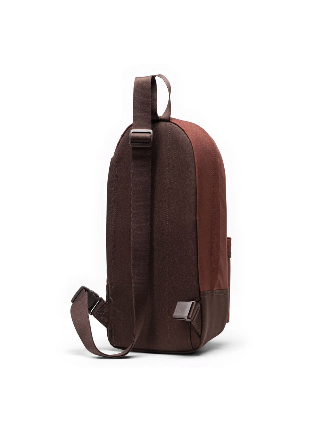The Herschel Heritage Shoulder Bag - 8L is a brown backpack made from recycled polyester with a main compartment, adjustable shoulder straps, and a top handle, shown standing upright against a white background.