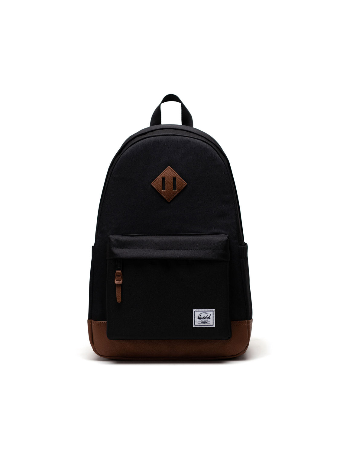A black Herschel Heritage Backpack with brown bottom and zipper pulls, front pocket, and a white logo patch at the bottom right corner, shown against a white background.