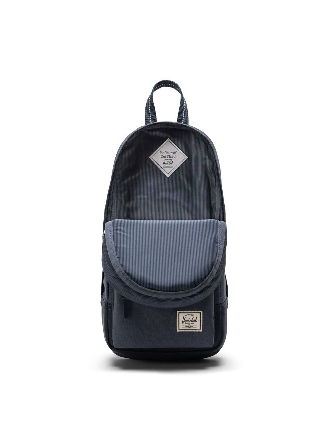 The Herschel Heritage Shoulder Bag - 8L in dark blue features a front pocket, striped flap, top handle, and a rectangular brand label at the bottom. Crafted from recycled polyester, it stands upright against a white backdrop.