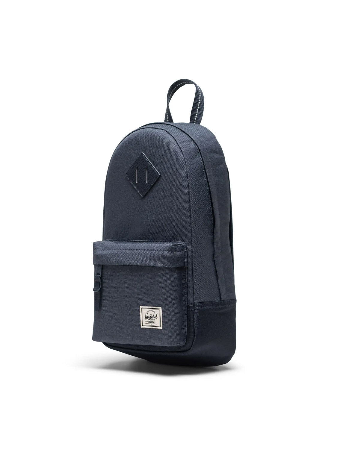 The Herschel Heritage Shoulder Bag - 8L is a dark blue recycled polyester backpack with a front zipper pocket, top handle, diamond patch, and small white label—ideal for those who love the iconic Herschel style.