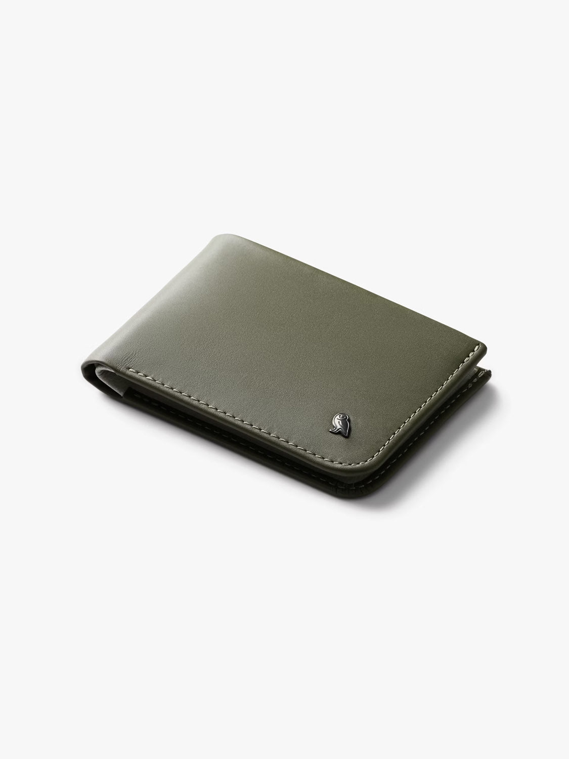The Bellroy Hide and Seek Low Wallet, in closed olive green eco-tanned leather with visible stitching and a small metallic logo at the bottom right, is displayed against a plain white background.