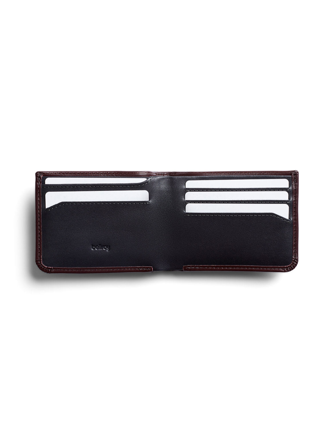 The Bellroy Hide and Seek Low Wallet by Bellroy is crafted from eco-tanned leather, featuring multiple card slots, some with blank cards. This dark brown wallet with a black interior offers RFID protection, a hidden coin pouch, and is displayed against a white background.