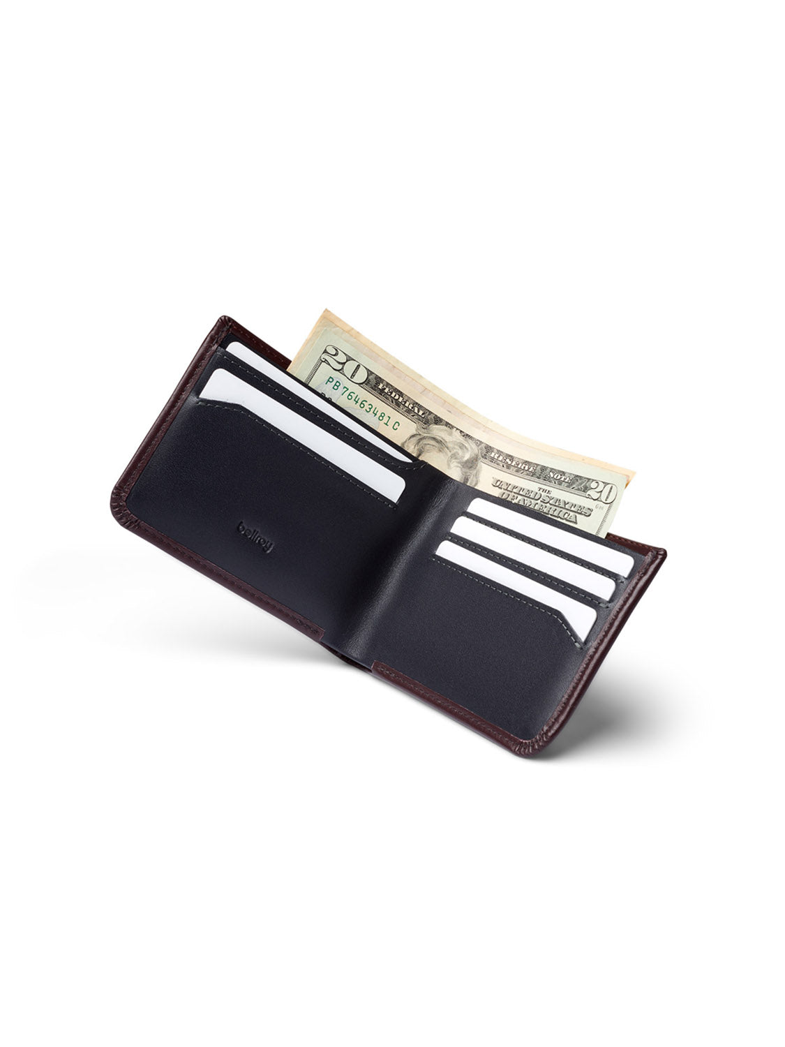 The Bellroy Hide and Seek Low Wallet by Bellroy is crafted from eco-tanned leather in brown. It features RFID protection, multiple credit card slots, visible cards, and a partially exposed folded U.S. twenty-dollar bill in the bill compartment, set against a plain white background.