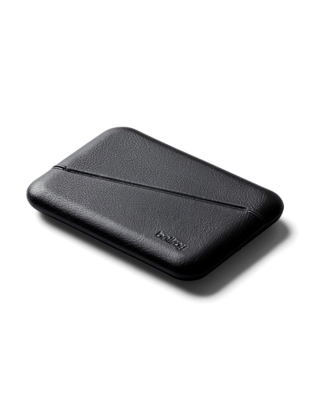 The Bellroy Flip Case Wallet is a sleek, black, rectangular wallet made from eco-tanned leather with subtle stitching, shown closed and flat on a white background, featuring the brand name embossed on the lower right corner.