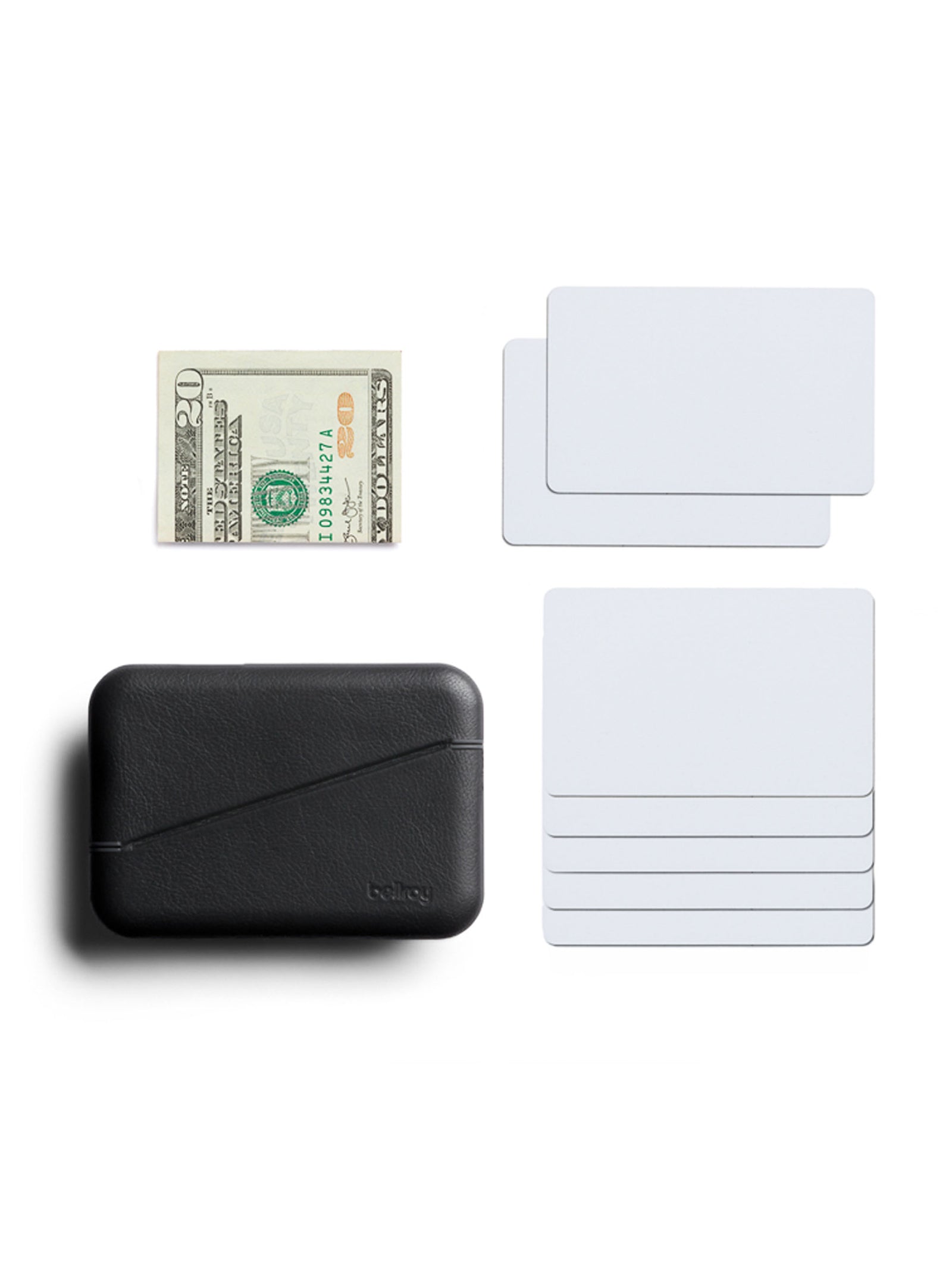 A Bellroy Flip Case Wallet in black eco-tanned leather with RFID protection is neatly displayed at the bottom left on a white surface, alongside a folded $20 bill and six blank white cards.