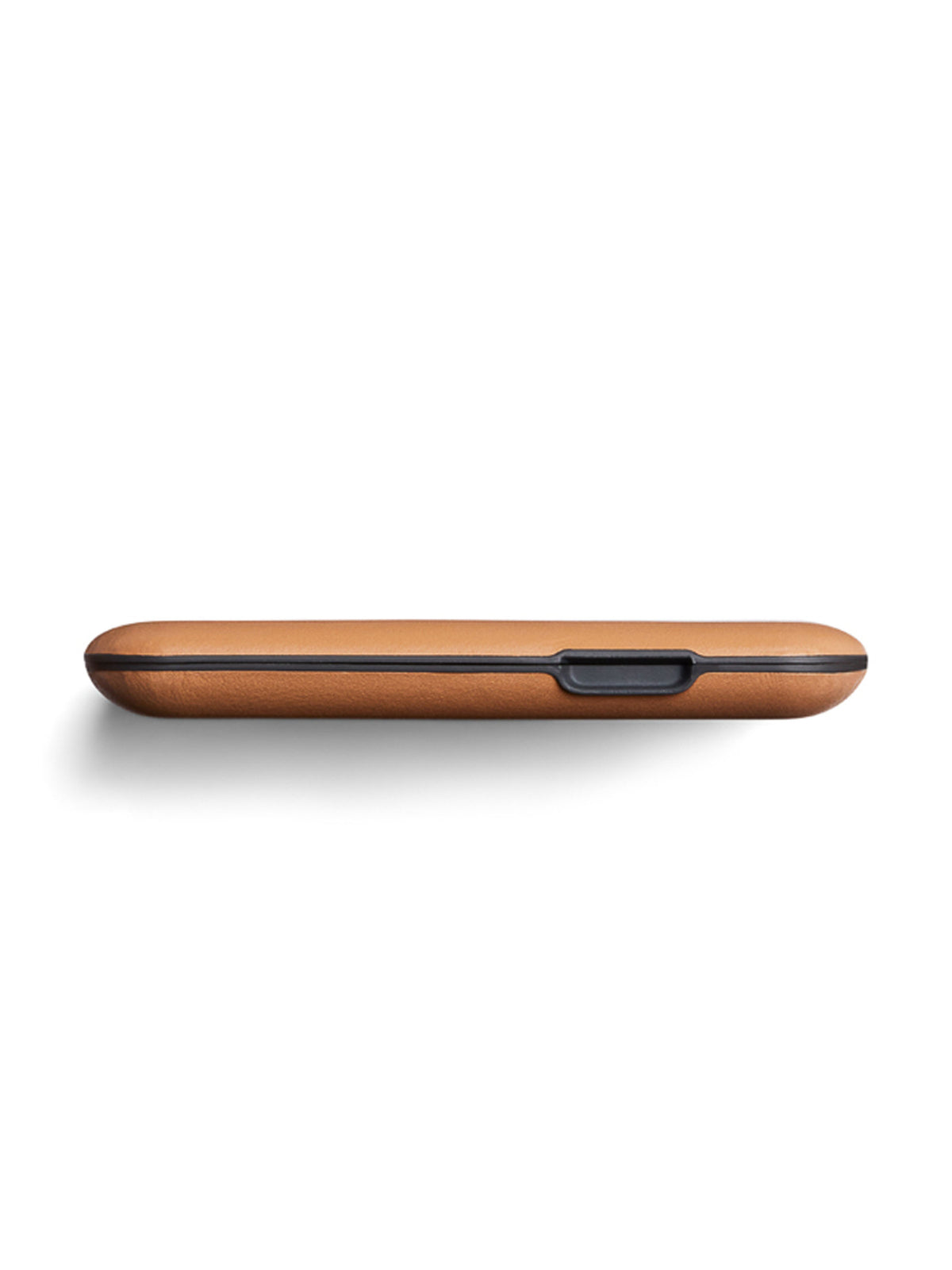 The Bellroy Flip Case Wallet is a slim, rectangular, tan eco-tanned leather case with rounded edges and a central black button, shown side-on against a white background.
