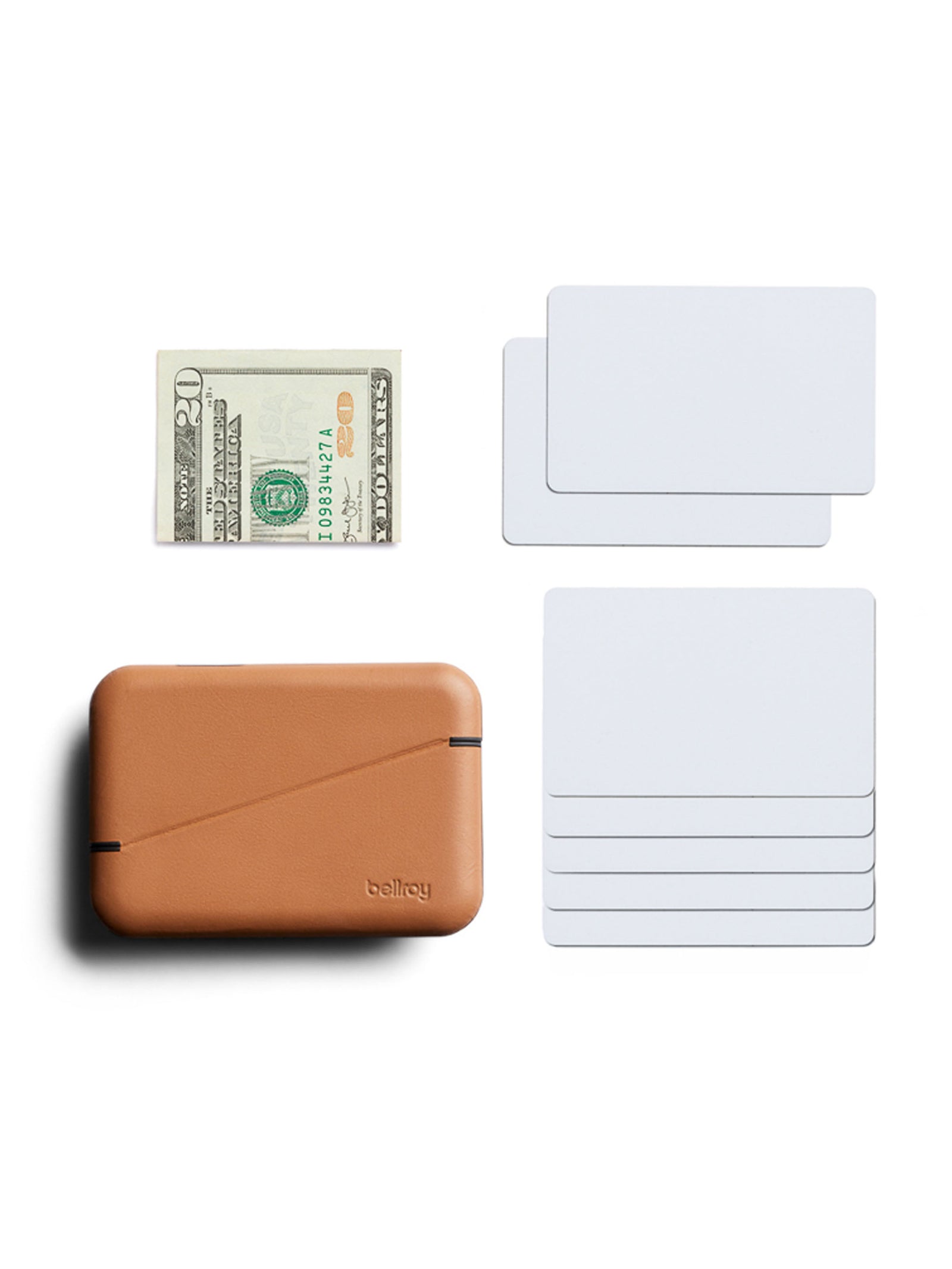 A tan Bellroy Flip Case Wallet made from eco-tanned leather is shown next to a folded $20 bill and seven blank white cards, all neatly arranged on a white background.