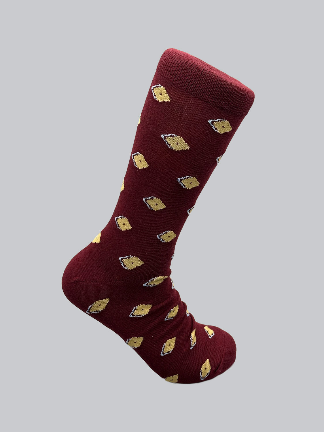 The Keda Graphic Socks by ID Menswear feature a maroon design with charming yellow hedgehog illustrations on a gray background, crafted from soft combed cotton for optimal comfort.