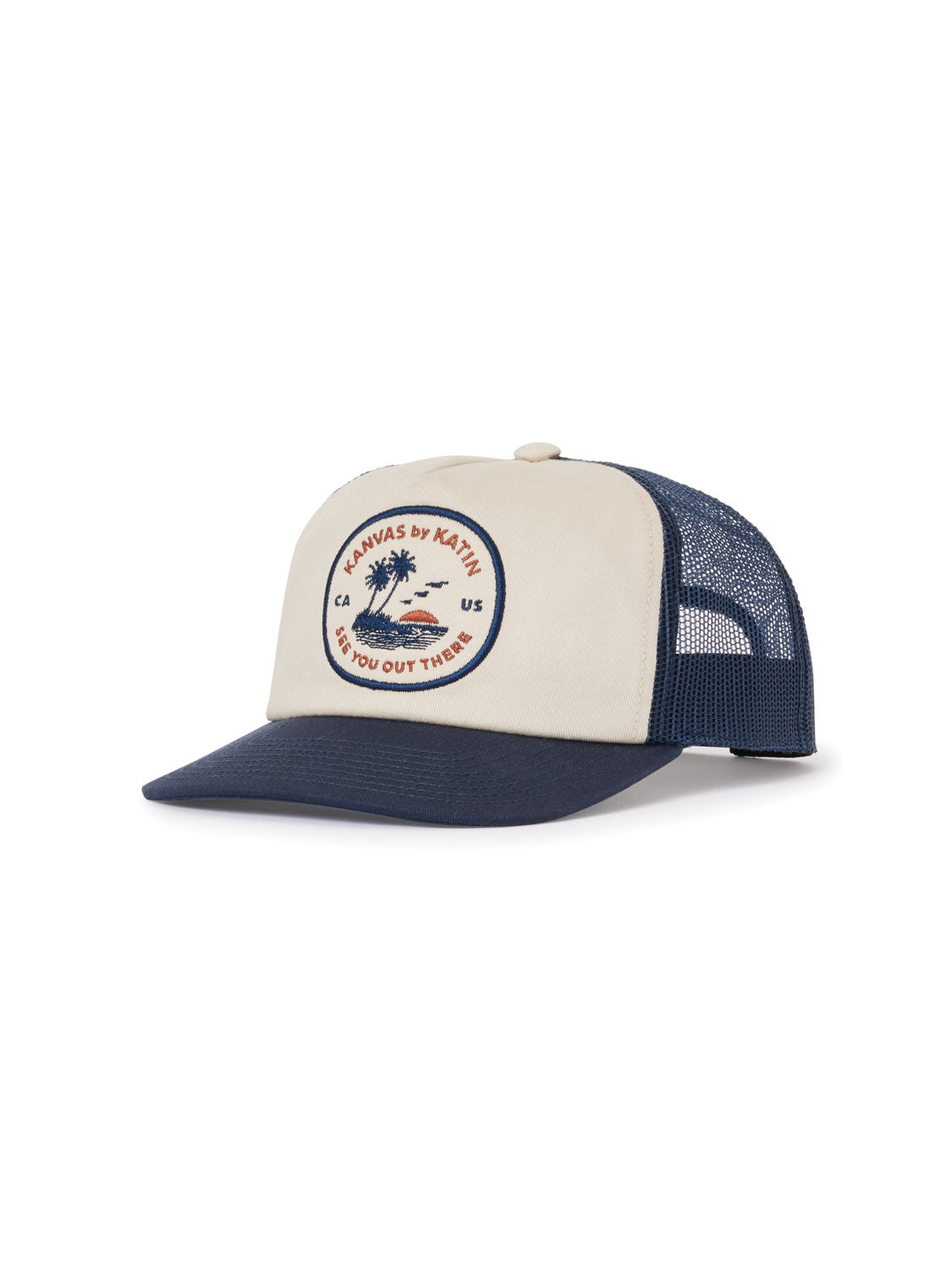 The Katin Keys Trucker Hat by Katin is a beige and navy blue cotton twill hat with a mesh back, featuring a round patch with a wave and palm tree design and text. It has a curved brim and an adjustable snapback closure for the perfect fit.