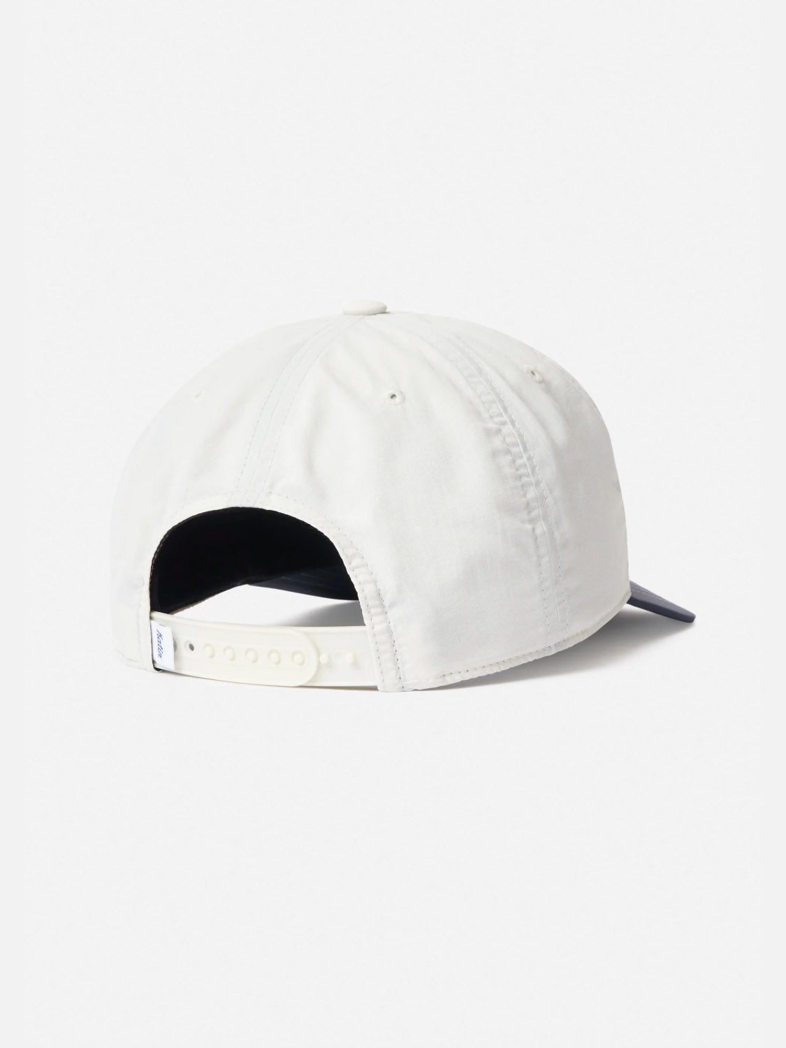 The Katin Largo Hat, made from white recycled nylon, is shown from the back with a slightly curved brim facing away and an adjustable snapback closure.