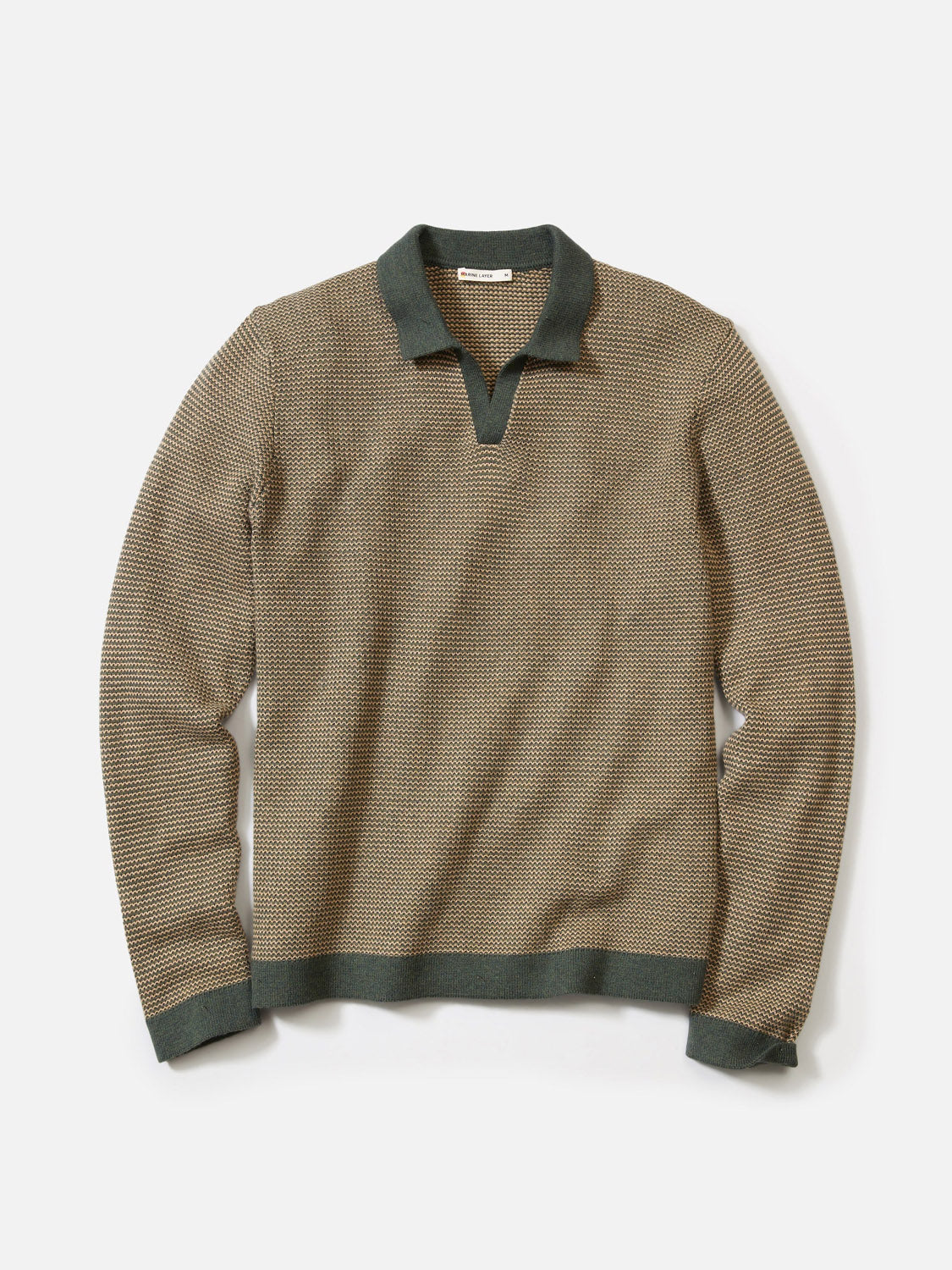 The Marine Layer Liam Long Sleeve Sweater Polo features a brown and black checkered merino wool knit with a dark green Johnny collar, cuffs, and hem, shown laid flat on a white background.