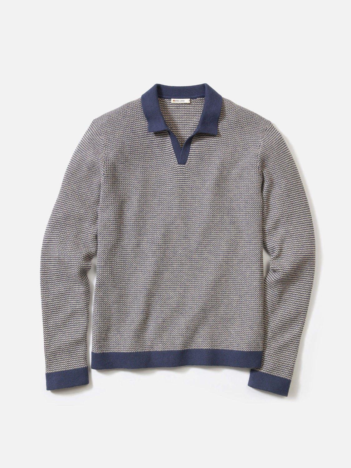The Marine Layer Liam Long Sleeve Sweater Polo features light gray Merino wool with a subtle pattern, a Johnny collar, and navy trim on the collar, cuffs, and hem.
