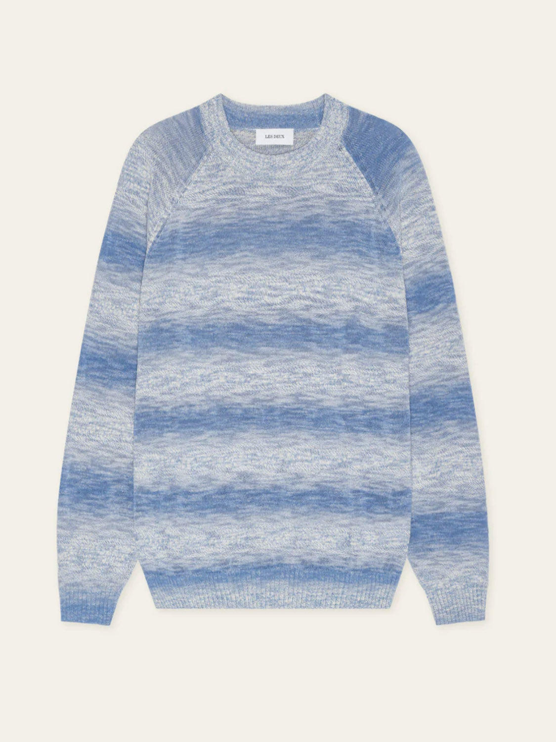 The Les Deux Light Gradient Knit is a blue and light gray striped crewneck sweater with long sleeves, a classic fit, and soft cotton-Tencel blend, shown laid flat on a light background.