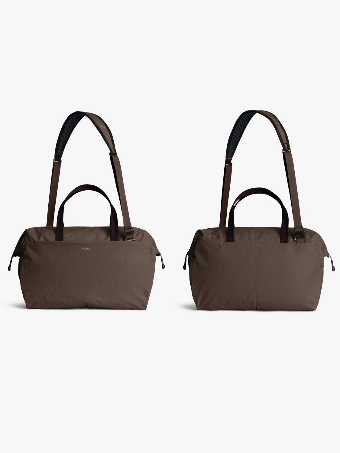 Two Bellroy Lite Duffle Bag - 30L in brown, featuring dark brown adjustable shoulder straps and handles, are displayed side by side on a white background. The left bag shows a small logo near the top.