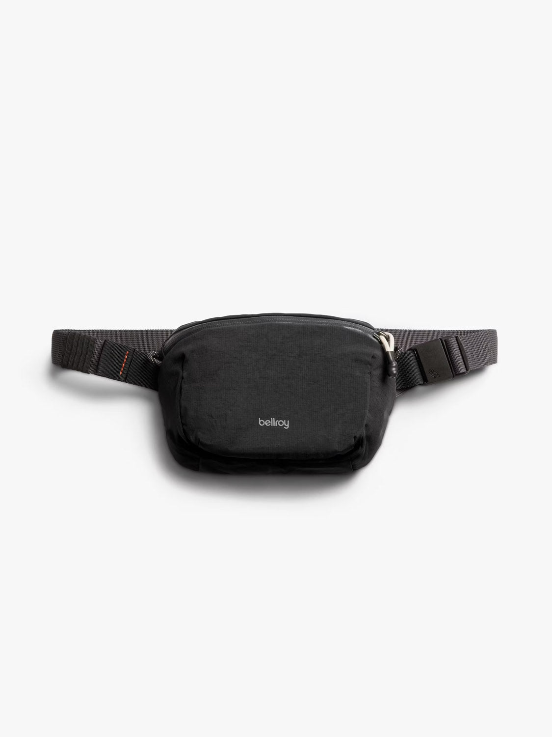The Bellroy Lite Belt Bag is a black, water-resistant sling with a zippered main compartment and adjustable strap, shown against a plain white background.