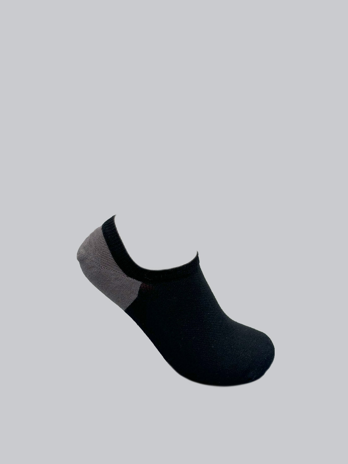 An M5 Combed Cotton Sock by ID Menswear is displayed diagonally on a plain background. This breathable sock features a black main body with a gray heel, crafted from combed cotton.