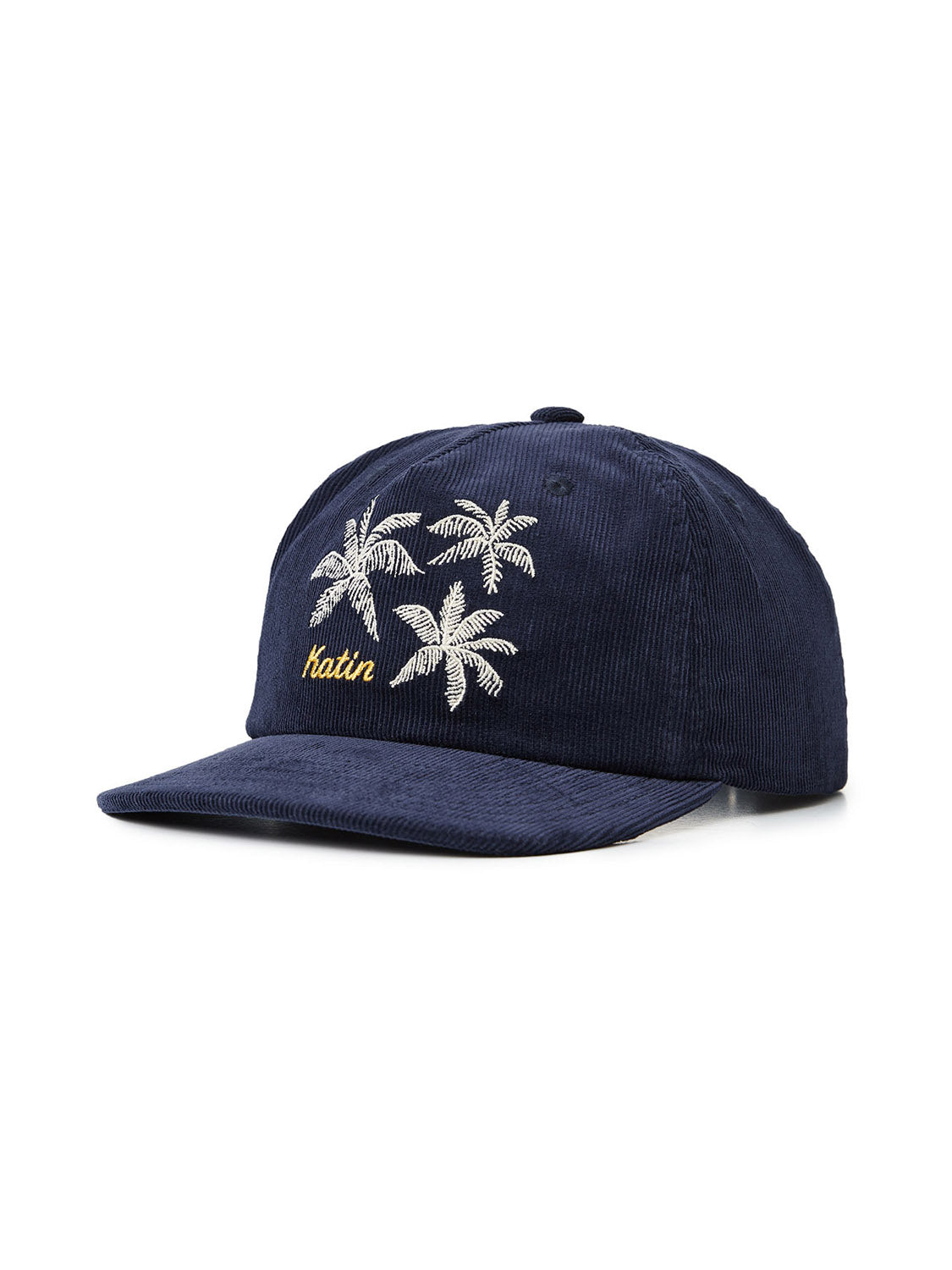 The Katin Mai Tai Hat is a navy blue cotton corduroy cap with small white palm tree embroidery and custom yellow Katin branding on the front. It features a curved brim, six-panel design, and adjustable snapback closure.