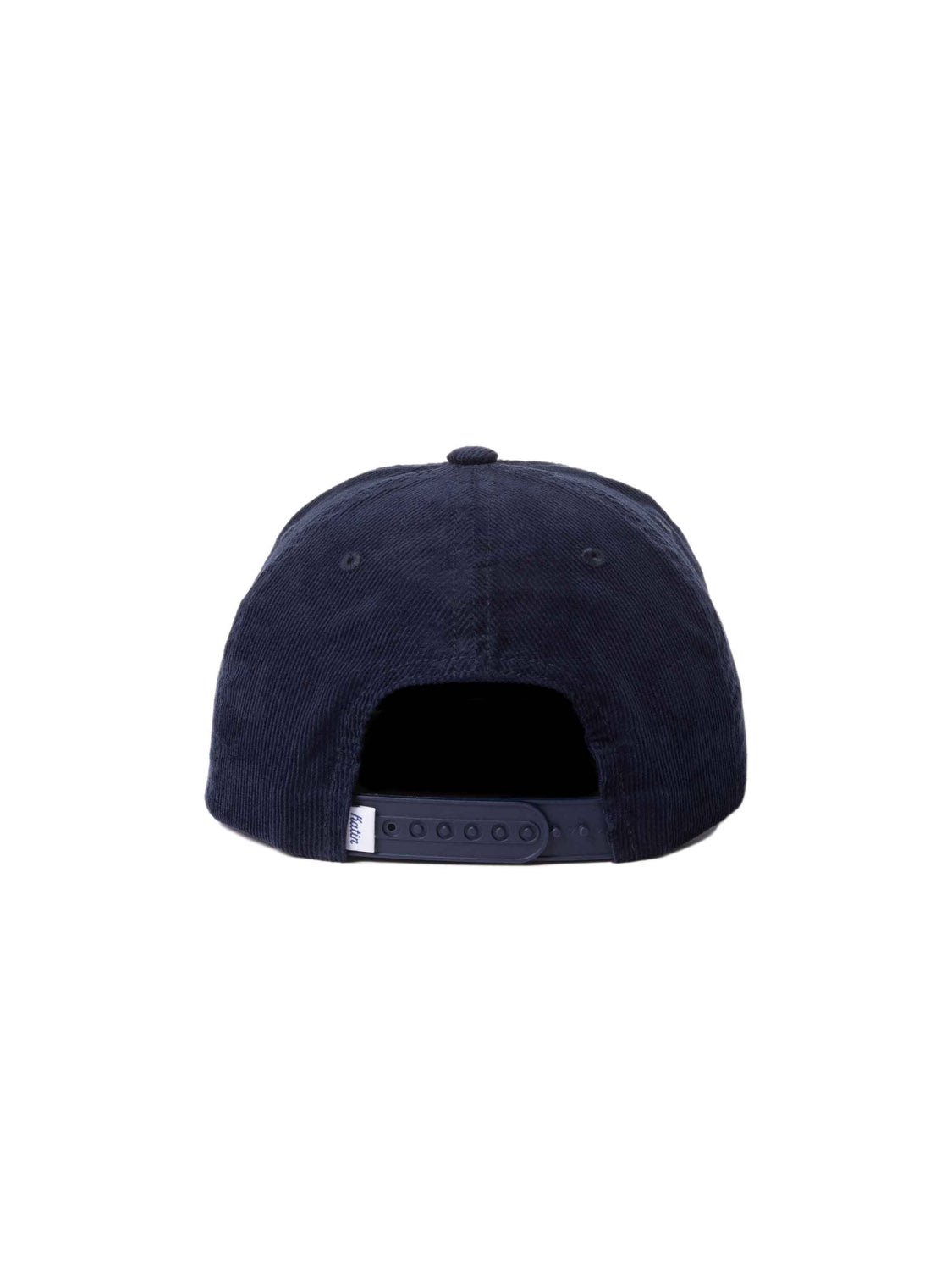The image features the back of the Katin Mai Tai Hat, a dark blue cotton corduroy baseball cap by Katin. It has an adjustable strap with a plastic snap closure and is topped with a small button, finishing its classic design.