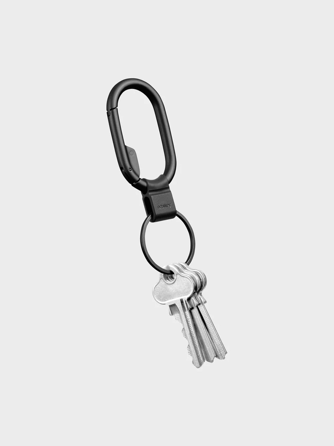 The Orbitkeys Clip Mini Keyring, in black minimalist design, holds a quick-release keyring with five silver keys, shown on a plain light gray background.