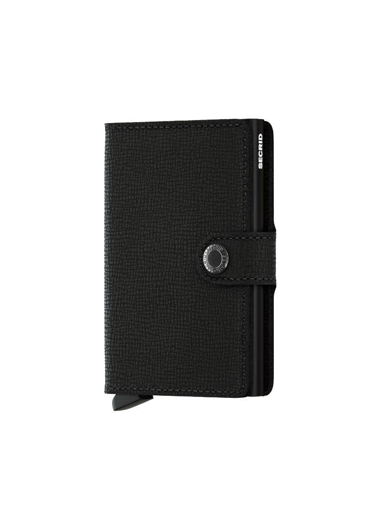 The Secrid Miniwallet Crisple is a black leather wallet with a textured finish, RFID security, snap button closure, and the Secrid logo in white on the side.