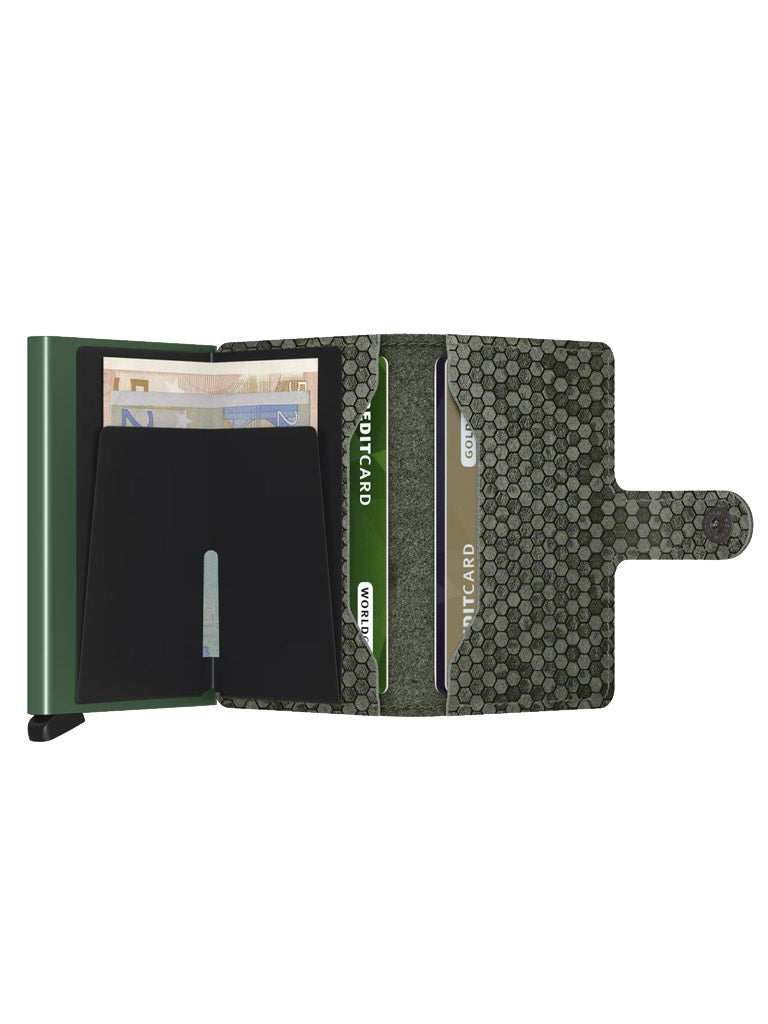 The Secrid Miniwallet Hexagon is a green leather wallet with RFID protection, a textured snap closure, hexagonal pattern interior, and compartments for cash, cards, and ID—combining style and functionality in a compact design.