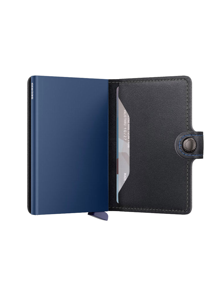 The Secrid Miniwallet Original by Secrid is a black European leather wallet with a snap closure, blue interior, RFID protection, and a card slot holding a credit card, shown open.
