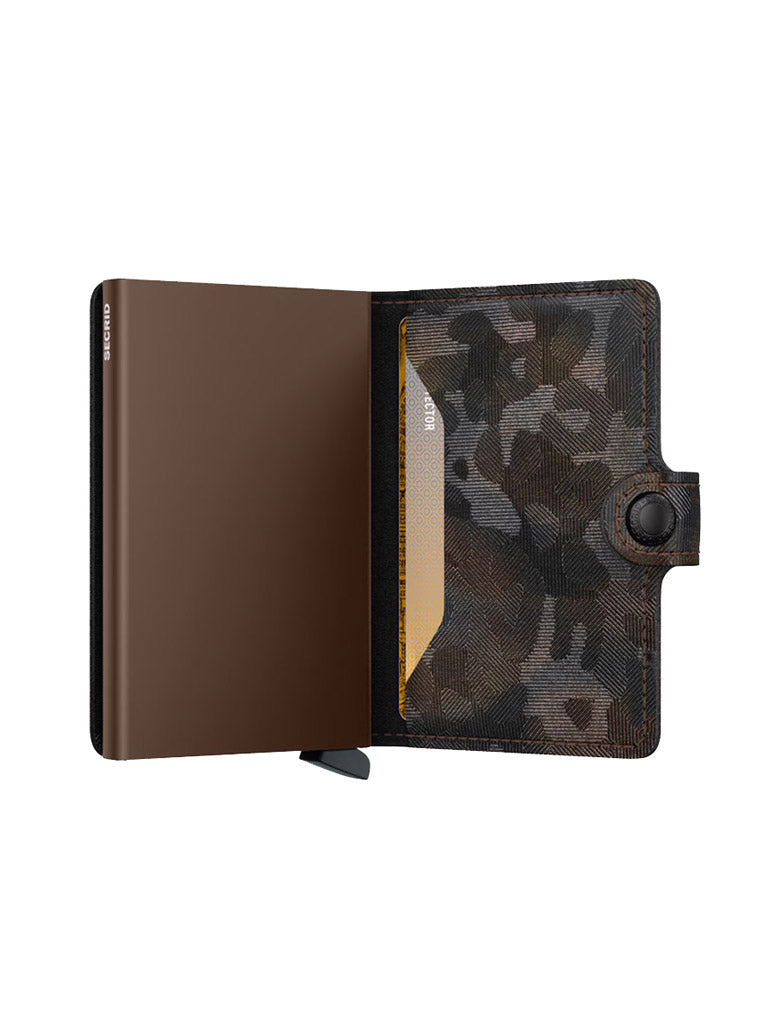 The Secrid Miniwallet Jungle by Secrid features a black and grey camouflage pattern in European leather, a brown interior, RFID protection, a snap button closure, and displays a single yellow card in the right slot when open.