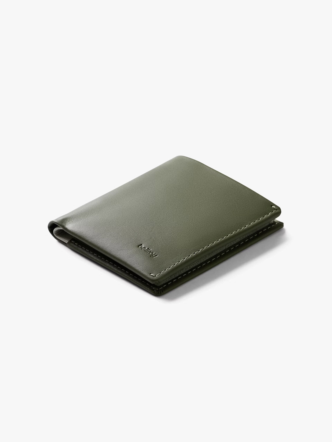 The Bellroy Note Sleeve Wallet is a slim, olive green leather billfold with visible stitching and a minimalist design, shown neatly folded on a plain white background.