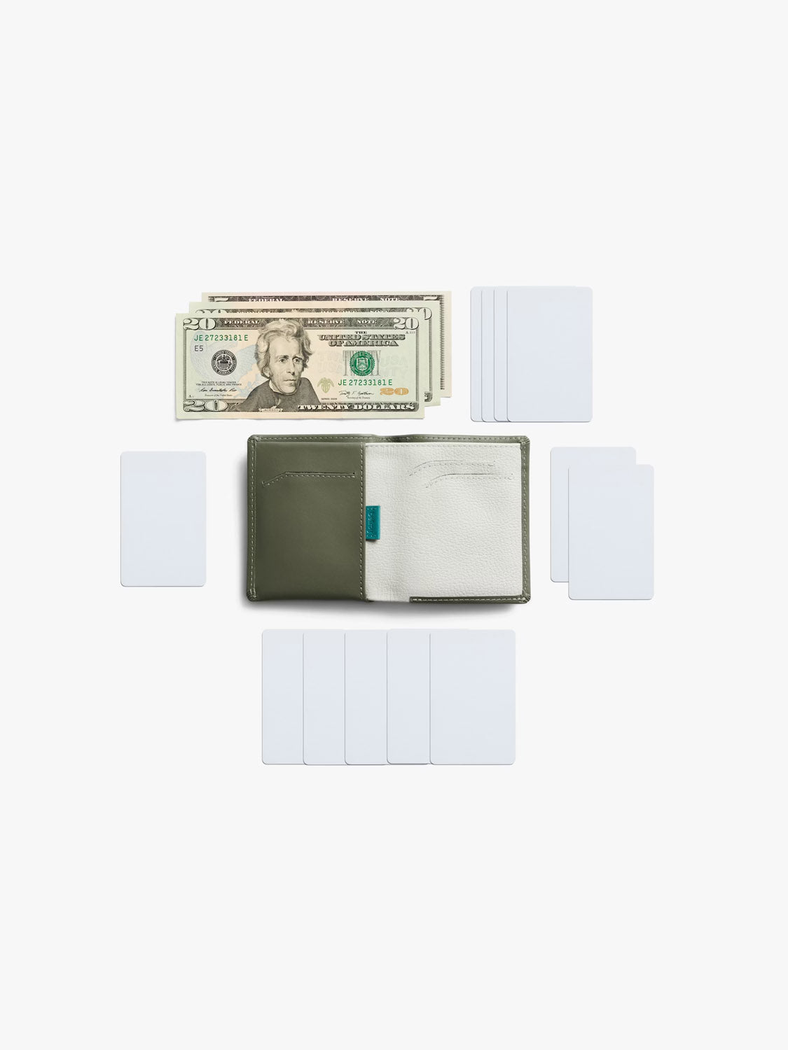 A Bellroy Note Sleeve Wallet in olive green and white is open on a white surface, showing U.S. twenty-dollar bills and empty white cards neatly arranged around it.
