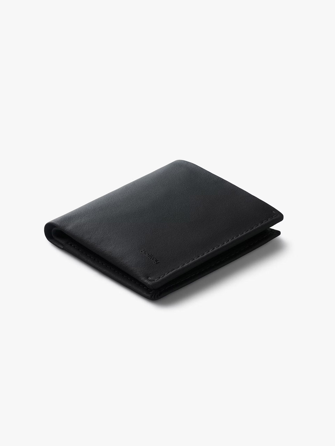 A black Bellroy Note Sleeve Innovera™ Edition wallet is shown closed on a white surface with soft shadows. This bifold includes RFID protection to help keep your cards secure.