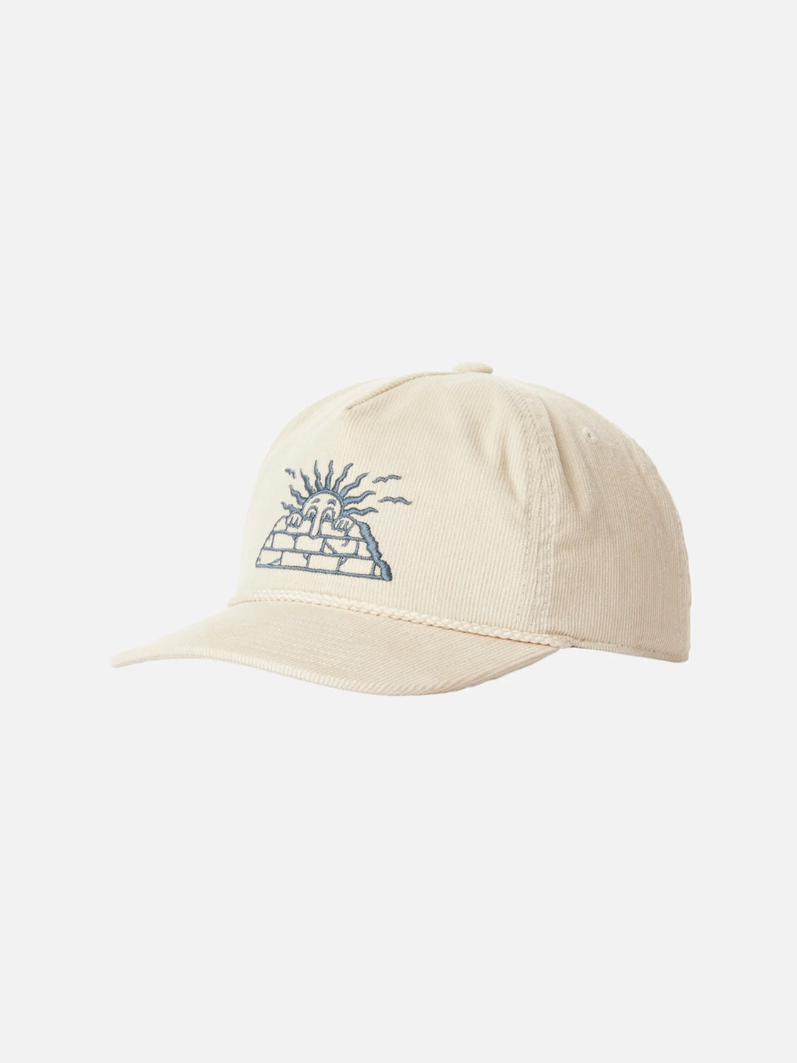 The Katin Peaks Hat is a beige cotton corduroy 5-panel cap with a blue sun-over-brick-wall embroidery and an adjustable snapback closure, shown on a white background.